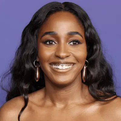 ayo edibiri wearing loose wavy hair