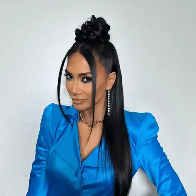 nicole scherzinger wearing middle part hairstyles with topknot