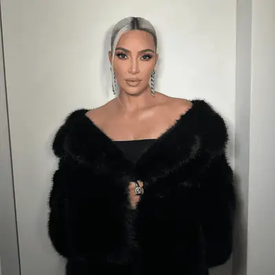 kim kardashian wearing sleek low bun with middle part