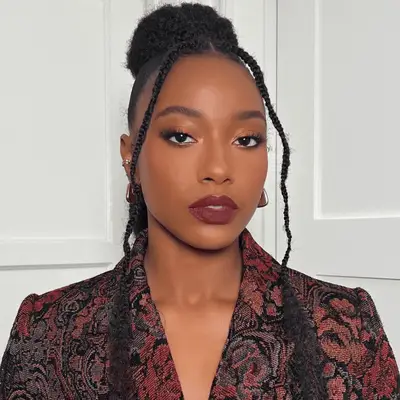 woman wearing middle part hairstyle with face-framing braids 