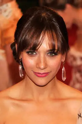 Rashida Jones wearing a braided side bun with a long fringe