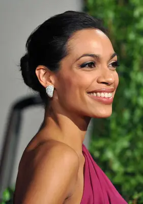 Rosario Dawson wearing a low chignon
