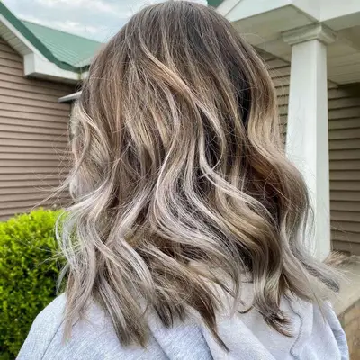 Back view of blonde hair with silvery balayage highlights
