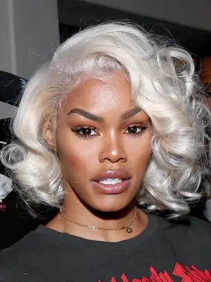 Teyana Taylor with white blonde curls