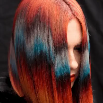 Kerry Washington with burgundy highlights in textured hair