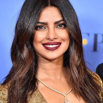 Priyanka Chopra with deep burgundy hair