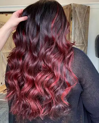 Burgundy ombré with lightest red at tips and black at scalp