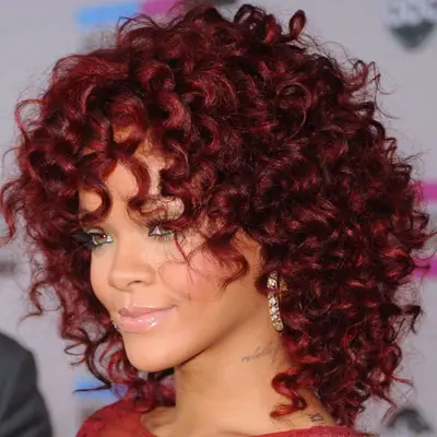 Rihanna with burgundy spiral hair