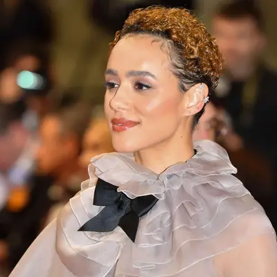 Nathalie Emmanuel with a copper brown curly pixie cut at the 2024 Cannes Film Festival