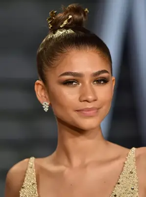 Zendaya with a sleek topknot
