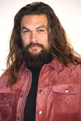 Jason Momoa with long hair on the red carpet
