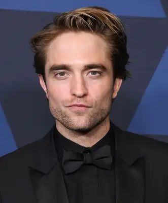 Robert Pattinson with long quiff hair on the red carpet