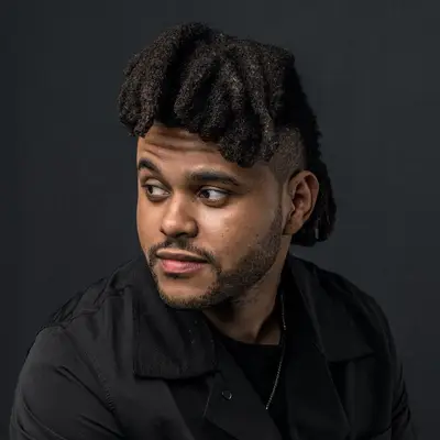 The Weeknd wears a loc mohawk with an undercut