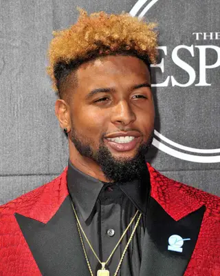 Odell Beckham Jr. with copper curly high top fade on the red carpet