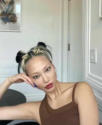 Soo Joo Park with dirty blonde space buns