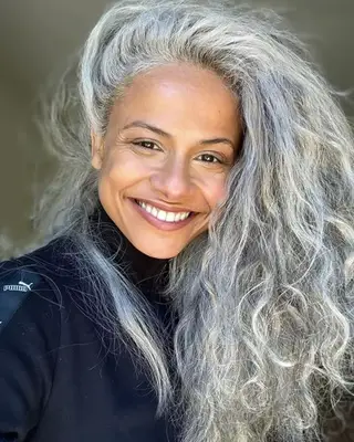 Woman with long, voluminous gray hair
