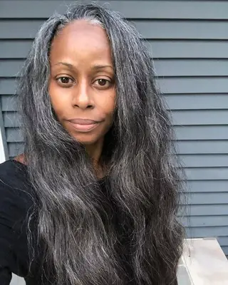 Woman with long gray brushed-out waves
