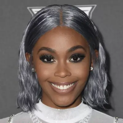 Nafessa Williams with a wavy gray hairstyle