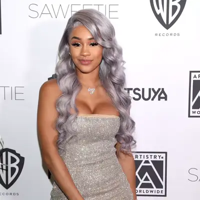 Julia Fox with gray-toned waves and bleach brows