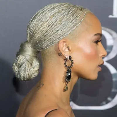 Zoe Kravitz with silver and blonde braids in low bun