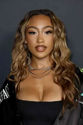 Actor Lexi Underwood with center parted blonde waves