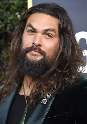 Jason Momoa with an unkempt beard and mustache at the 2020 Golden Globes Awards in Beverly Hills, California