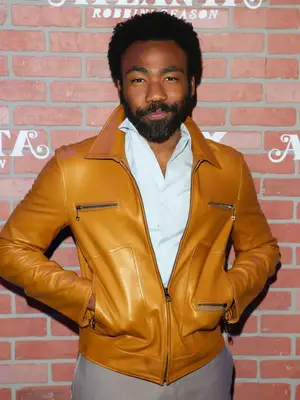 Donald Glover with a full beard and mustache at the 2018 