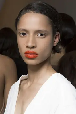 A model wears a short braided hairstyle