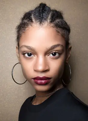 A model with short cornrows