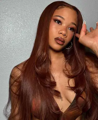 Actress Storm Reid with a copper red hair color
