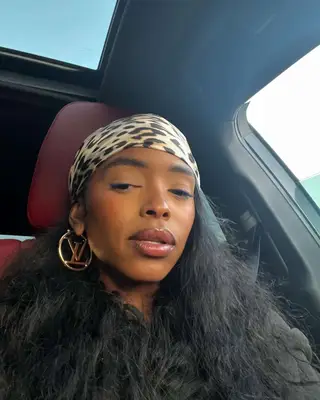 Actor Lovie Simone with a silk scarf wrapped around the front of her hair