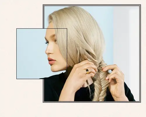 WOMAN BRAIDING A FISHTAIL BRAID ON BLONDE HAIR
