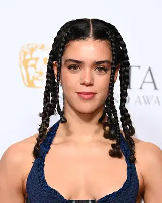 Person with braided hairstyle at an event