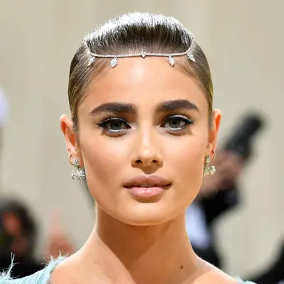 Taylor Hill wears a bedazzled headpiece to section her hair at the Met Gala
