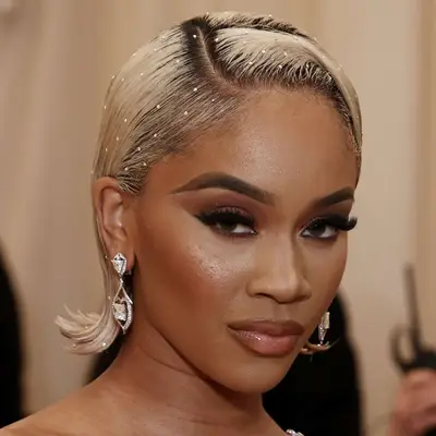 Saweetie wears small jewels on the surface of her flippy bob