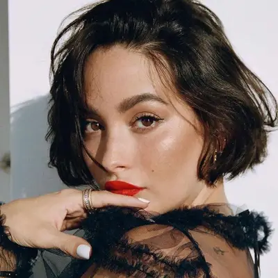 Taylor Lashae with a chic, French-style side part bob