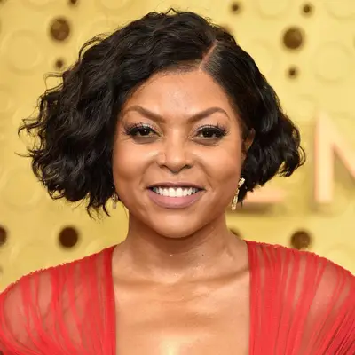 Taraji P. Henson with a curly/wavy side part bob