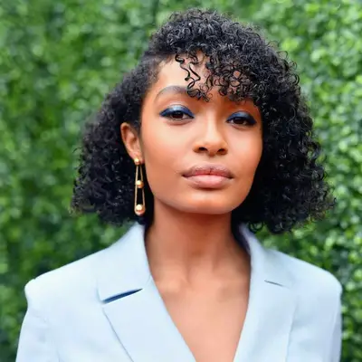 Yara Shahidi with a coily, side parted bob