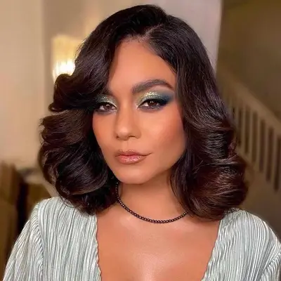 Vanessa Hudgens with a disco-inspired side-parted bob