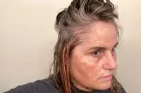 A person applies Curlsmith Hair Makeup Temporary Color Styling Gel