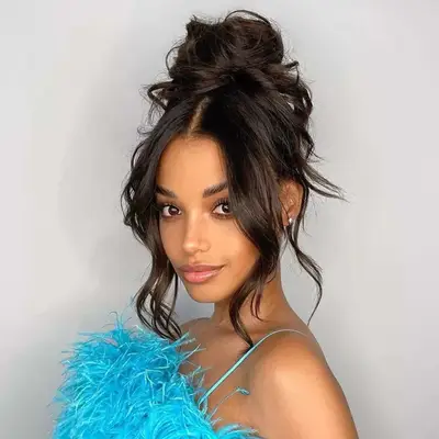 Actor Ella Balinska with a touseled, tendriled updo