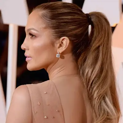 Actor Jennifer Lopez with her hair in a slicked-back ponytail