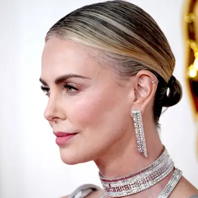 Charlize Theron with a micro pony tail 