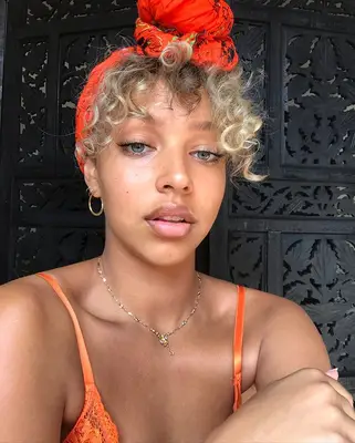 Curly blonde updo with hair scarf