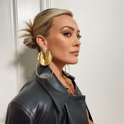 Hilary Duff wears a slicked-back spiky bun