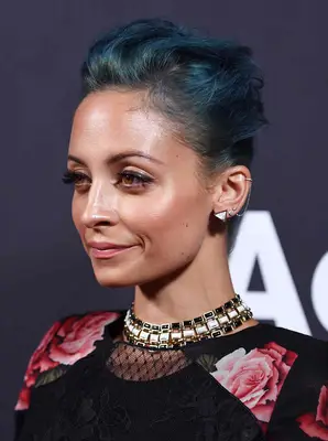 Nicole Richie wearing blue wear in an updo style