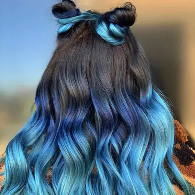 Curled blue ombre hair with double topknots