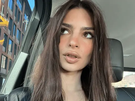 emrata looking out side of car window