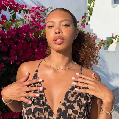 slick ponytail with voluminous curls 