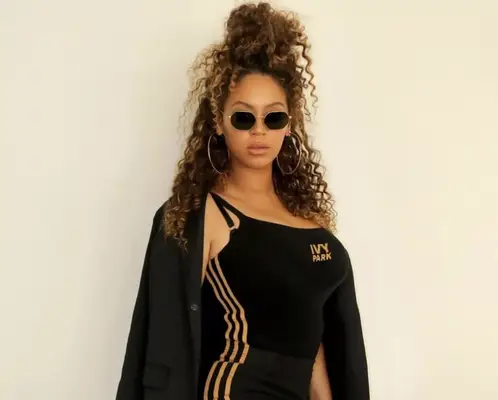 Beyonce wearing Ivy Park in a sporty half-up hairstyle